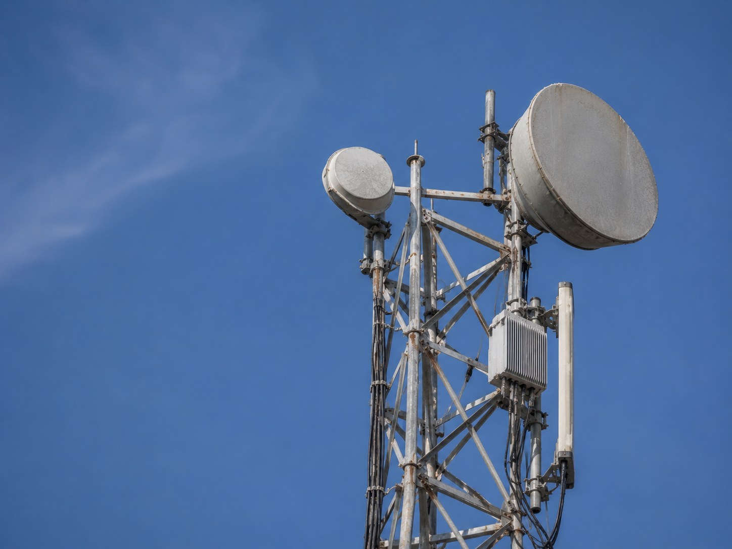 Completed microwave installation photographed against a clear sky.